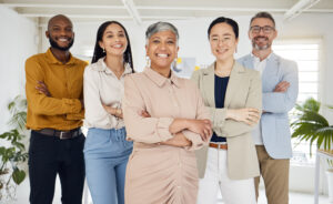 portrait, management and arms crossed with a business team in the office for collaboration. teamwork, diversity and leadership with a happy employee group together in their professional workplace