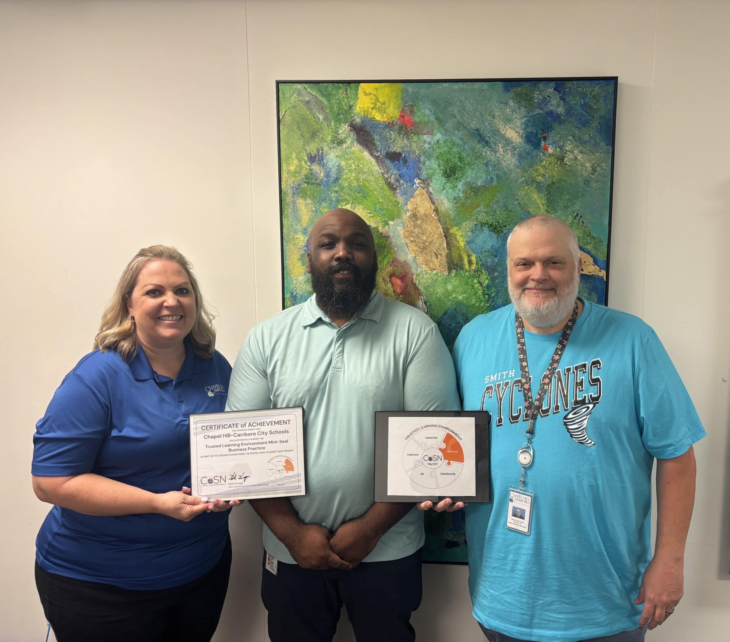 Chapel Hill-Carrboro City Schools staff receiving digital learning recognition from CoSN.