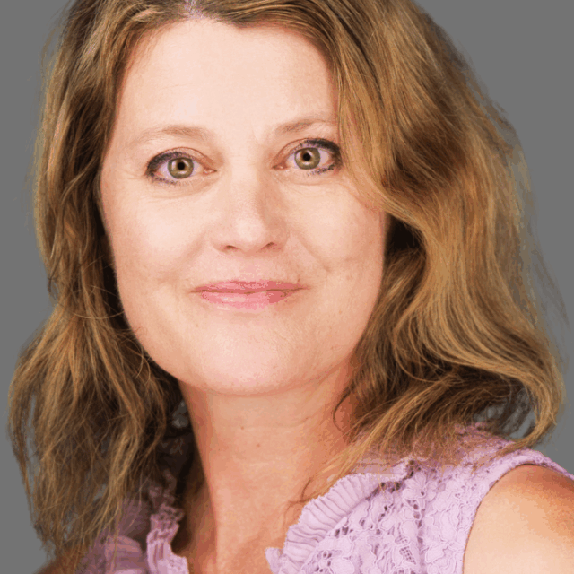 A headshot of a woman smiling