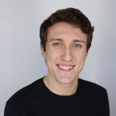 Bright young man smiling, professional portrait